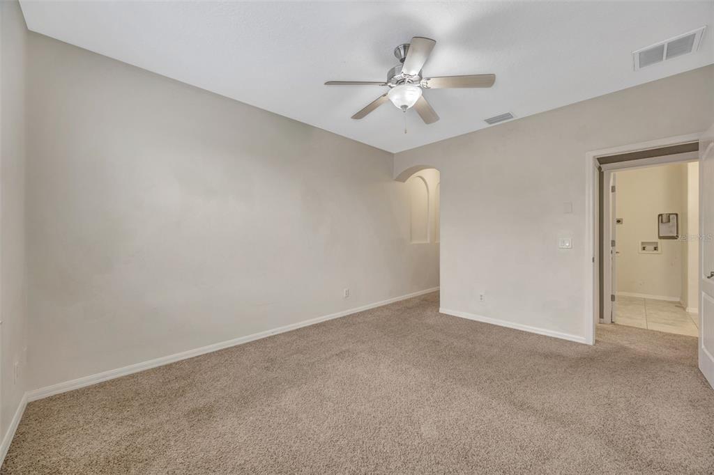 6020 Fishhawk Crossing Boulevard Lithia, FL 33547 - Photo 39 of 68 a view of an empty room with a chandelier fan