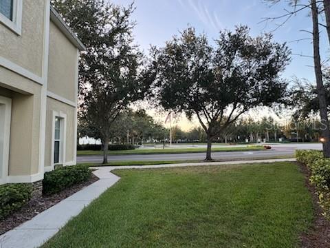 6020 Fishhawk Crossing Boulevard Lithia, FL 33547 - Photo 49 of 68 a building with trees in the background