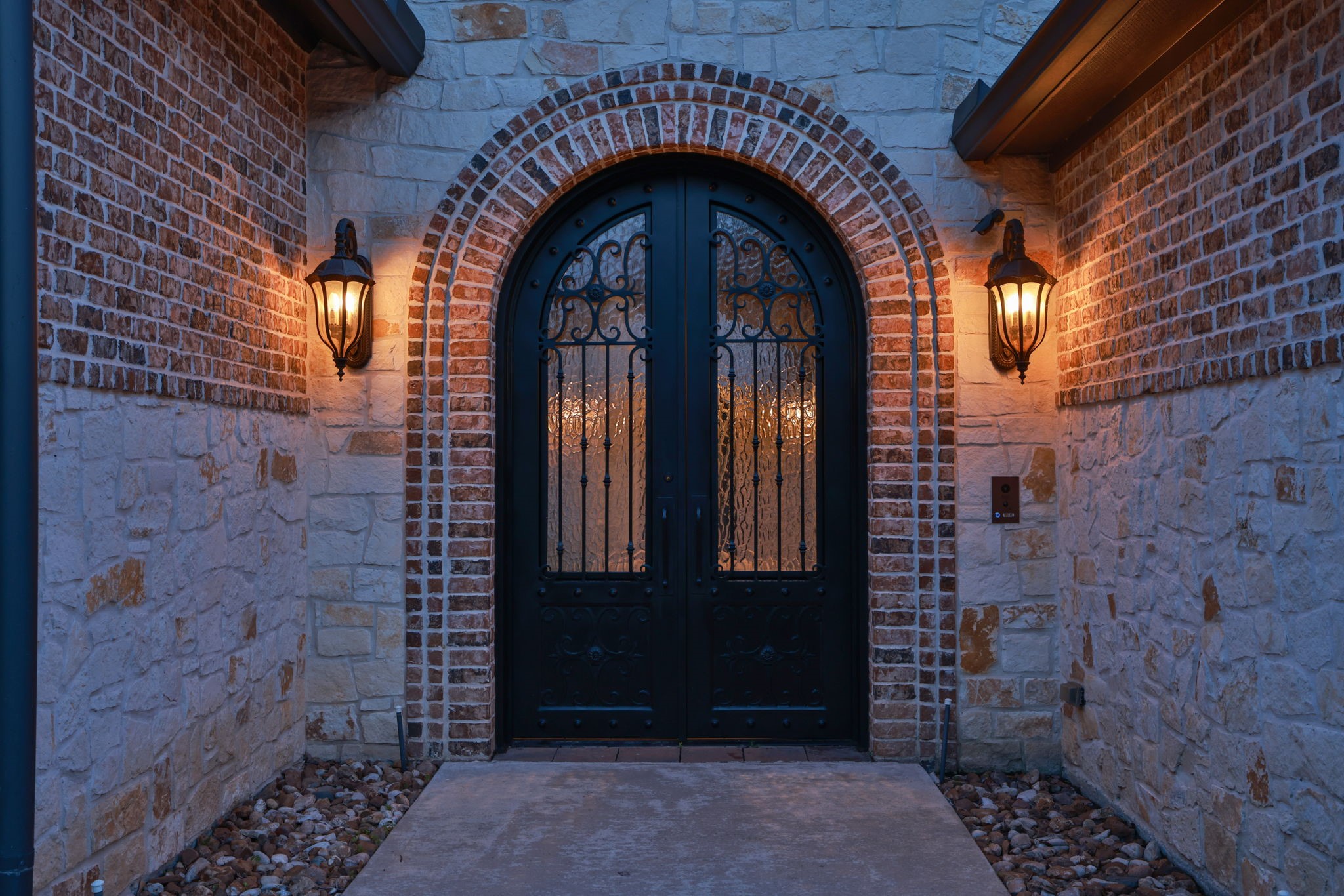 6918 Comanche Bend Montgomery, TX 77316 - Photo 10 of 50 Such a warm and inviting space to greet family and guests, let’s step into luxury! Enter through your private paved courtyard with access to your very own casita featuring a full bathroom, perfect for guests, multigenerational living, private office space, or a personal retreat.