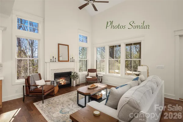 a living room with furniture fireplace and window