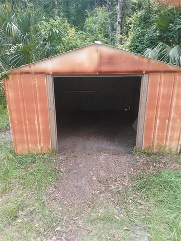 a view of a backyard of the house