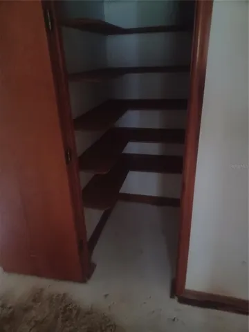 a view of staircase with white walls