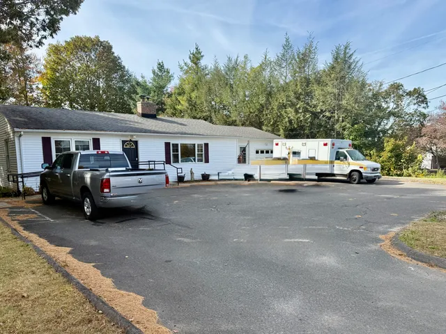 a view of street with parked cars