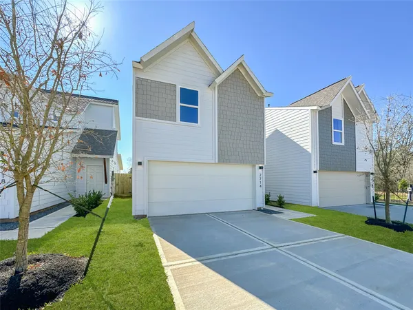 a view of a dining room with furniture wooden floor and chandelier
