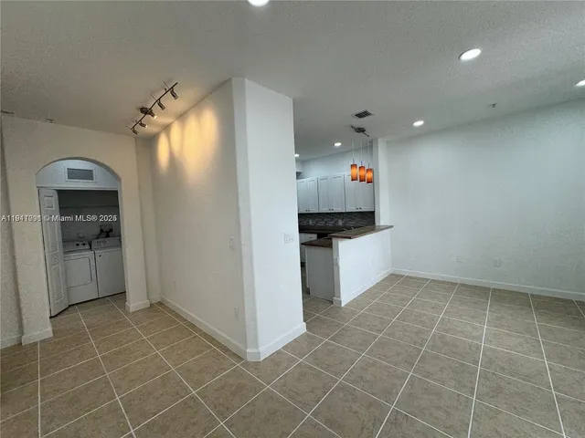 a kitchen with stainless steel appliances a sink stove and cabinets