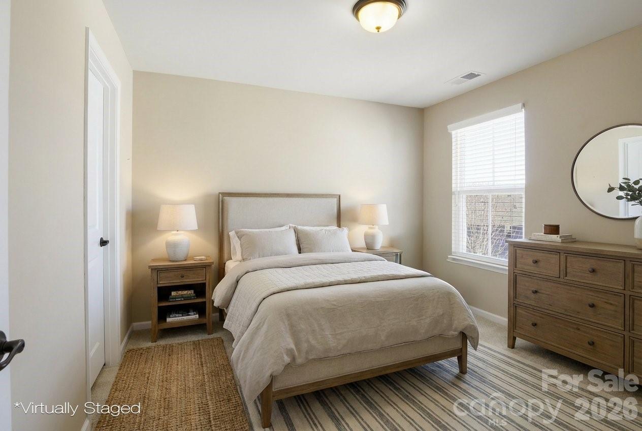 5009 St Clair Street Fort Mill, SC 29715 - Photo 11 of 40 a bedroom with a bed and a dresser