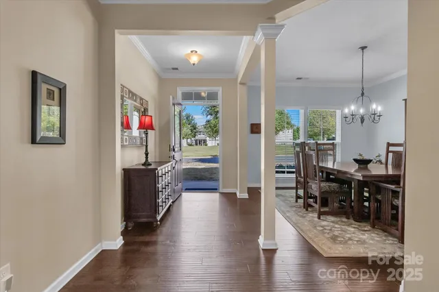 a view of a dining area with furniture window and wooden floor