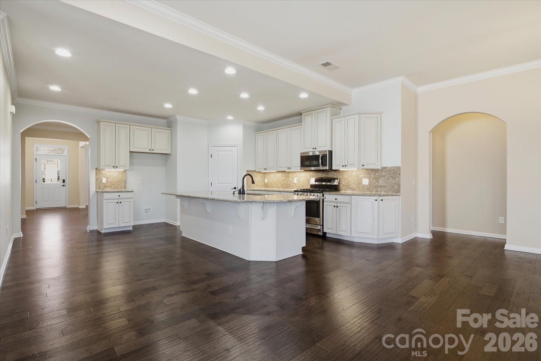 5009 St Clair Street Fort Mill, SC 29715 - Photo 19 of 40 a view of kitchen with granite countertop stainless steel appliances refrigerator sink and cabinets