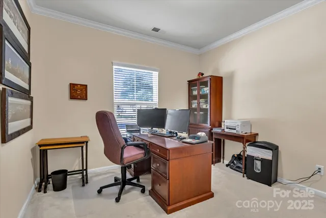 a view of a workspace with furniture