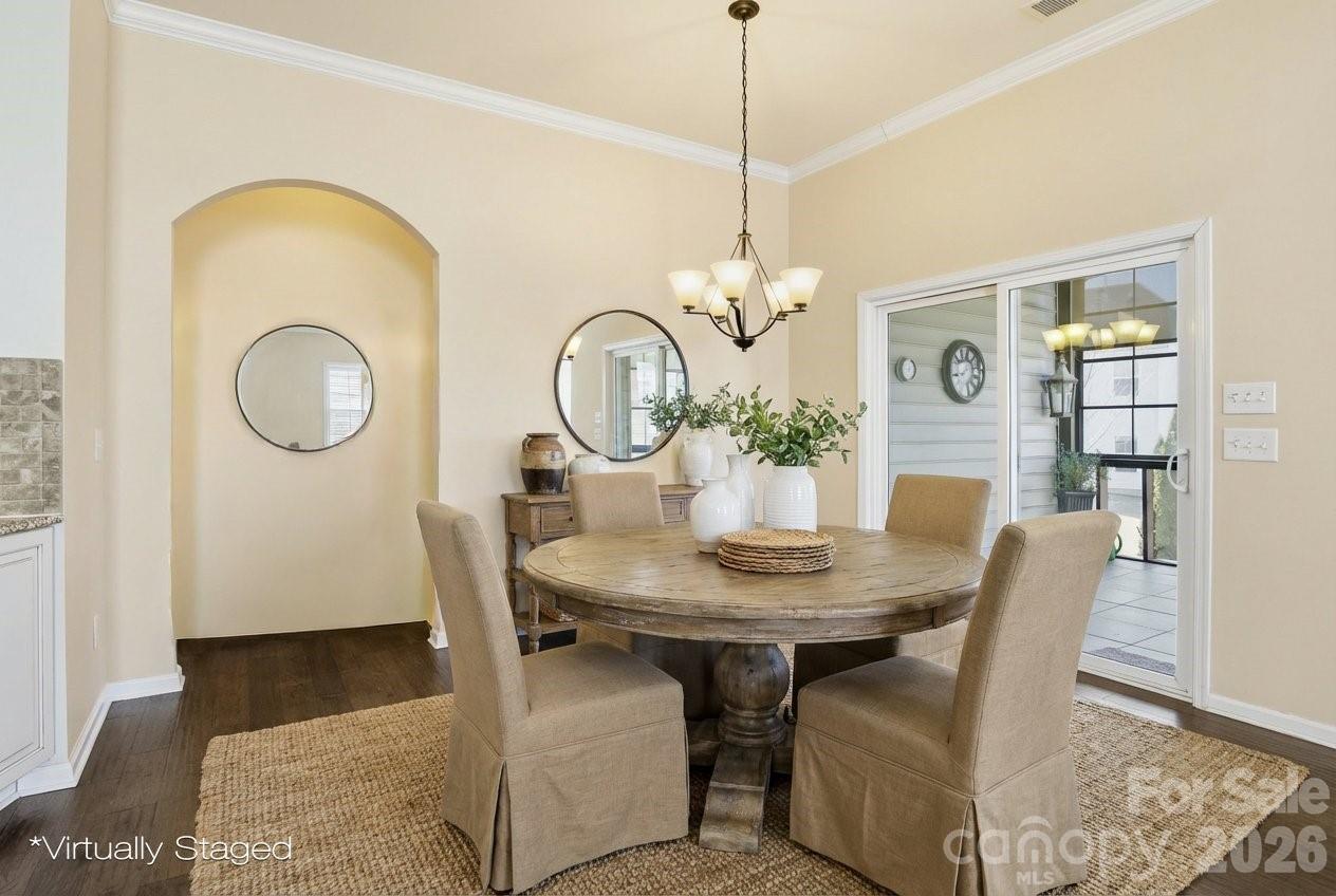 5009 St Clair Street Fort Mill, SC 29715 - Photo 6 of 40 a view of a dining room with furniture and chandelier