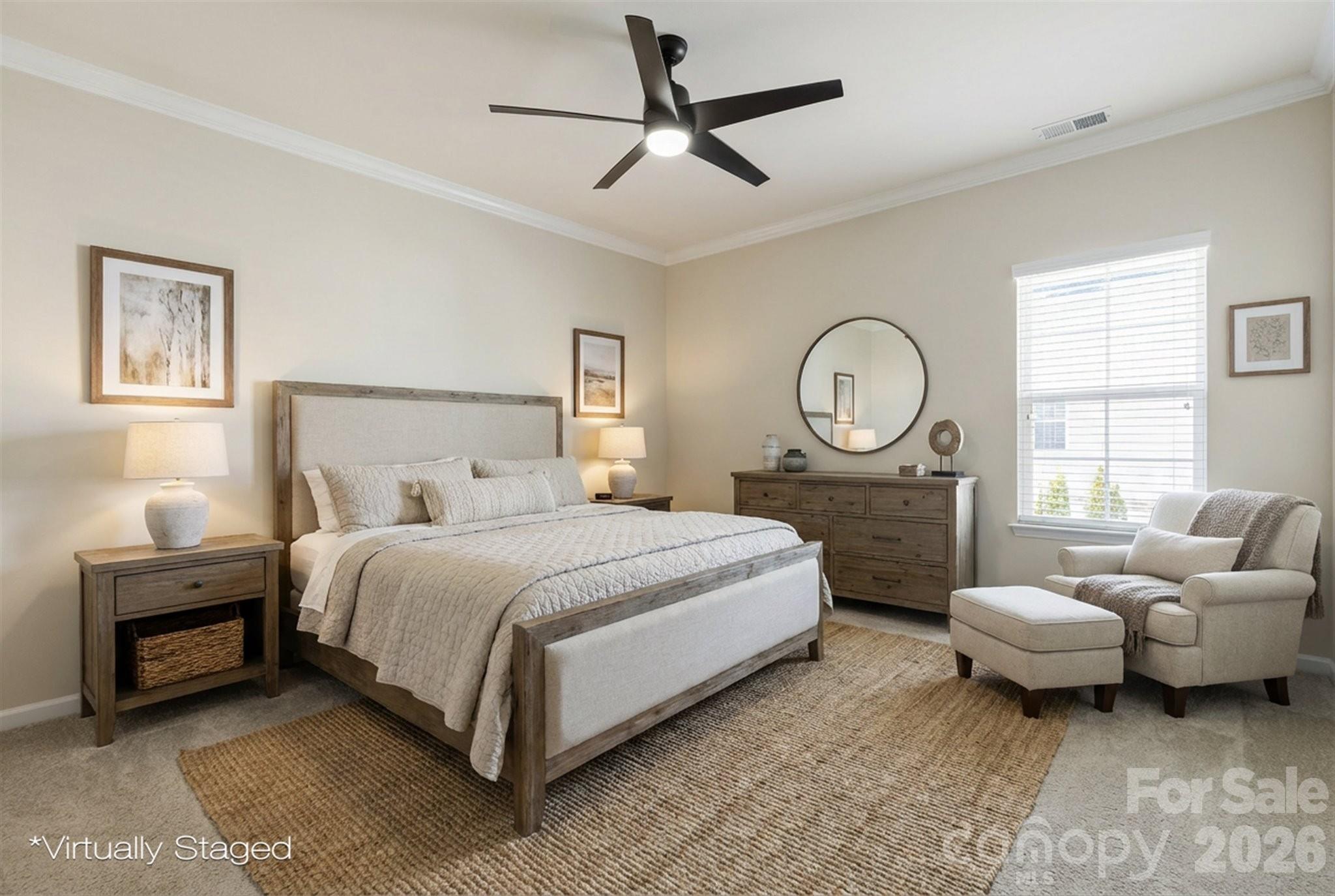 5009 St Clair Street Fort Mill, SC 29715 - Photo 10 of 40 a spacious bedroom with a bed a couch and a window