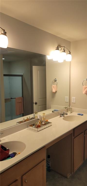 3433 Cascade Parc Boulevard Southwest Atlanta, GA 30311 - Photo 14 of 30 a bathroom with a sink and a mirror