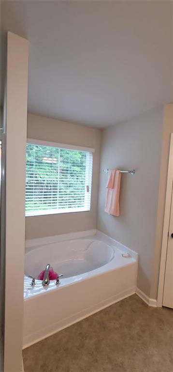 3433 Cascade Parc Boulevard Southwest Atlanta, GA 30311 - Photo 16 of 30 a bathroom with a tub sink and window