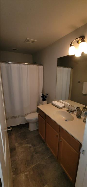 3433 Cascade Parc Boulevard Southwest Atlanta, GA 30311 - Photo 17 of 30 a bathroom with a granite countertop sink toilet and shower