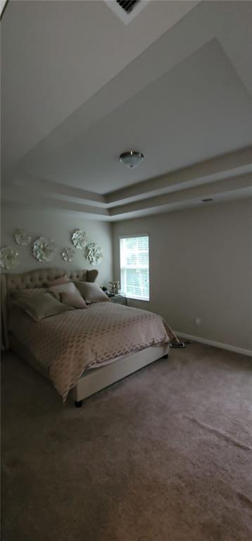 3433 Cascade Parc Boulevard Southwest Atlanta, GA 30311 - Photo 23 of 30 a bed sitting in a room next to a window