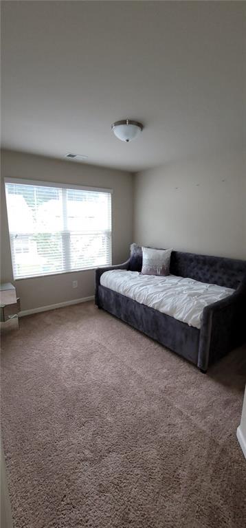 3433 Cascade Parc Boulevard Southwest Atlanta, GA 30311 - Photo 26 of 30 a spacious bedroom with a bed and window