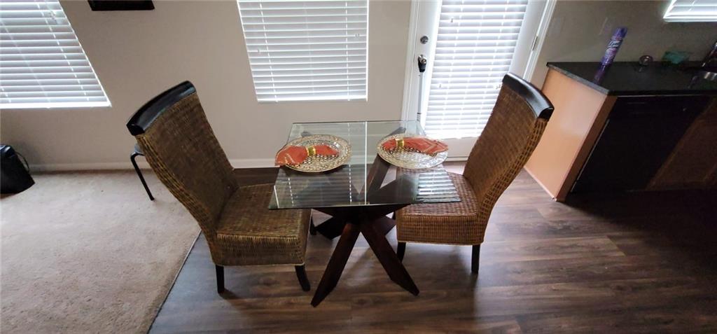 3433 Cascade Parc Boulevard Southwest Atlanta, GA 30311 - Photo 7 of 30 a view of a dining room with furniture and wooden floor