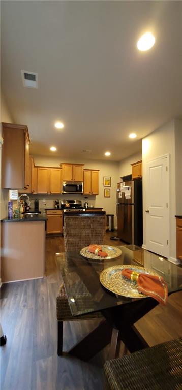 3433 Cascade Parc Boulevard Southwest Atlanta, GA 30311 - Photo 8 of 30 a view of a kitchen with kitchen island a sink and appliances