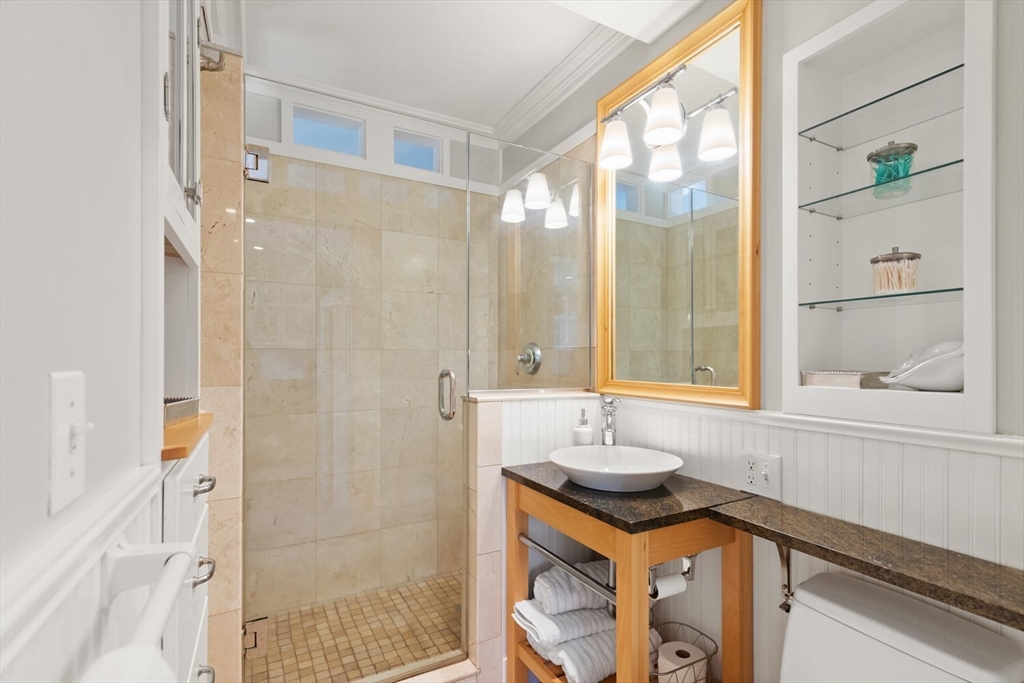 150 Prospect Street, Unit 3 Gloucester, MA 01930 - Photo 15 of 25 a bathroom with a sink and a mirror