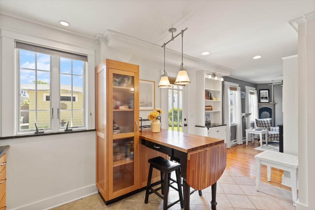 150 Prospect Street, Unit 3 Gloucester, MA 01930 - Photo 10 of 25 a very nice looking dining room with a large window and chandelier