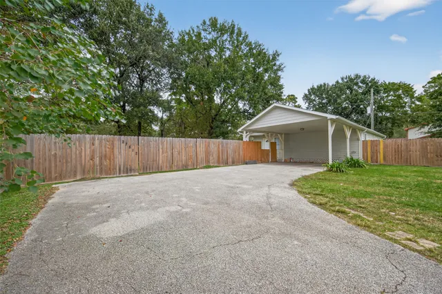 a backyard of a house with lots of green space