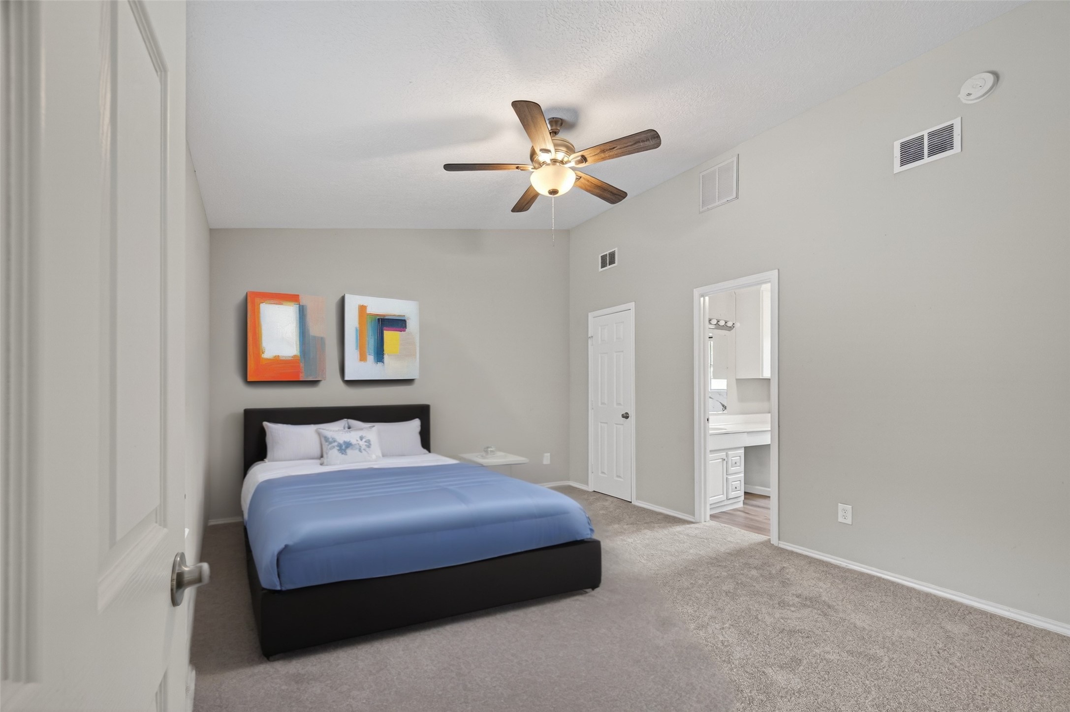27812 Red Fox Road Tomball, TX 77377 - Photo 14 of 33 a bedroom with a bed and a ceiling fan