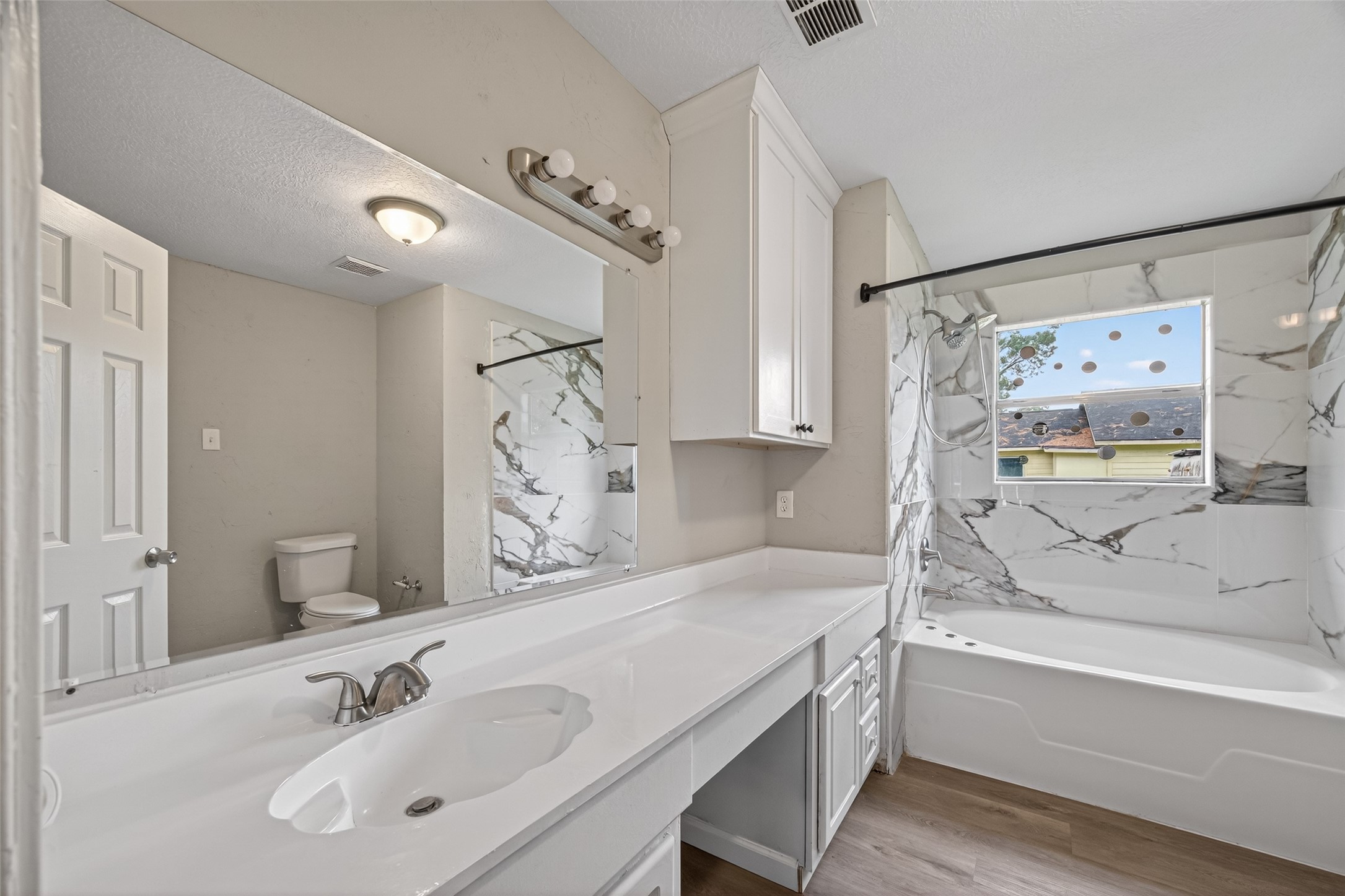 27812 Red Fox Road Tomball, TX 77377 - Photo 17 of 33 a bathroom with a tub sink and mirror