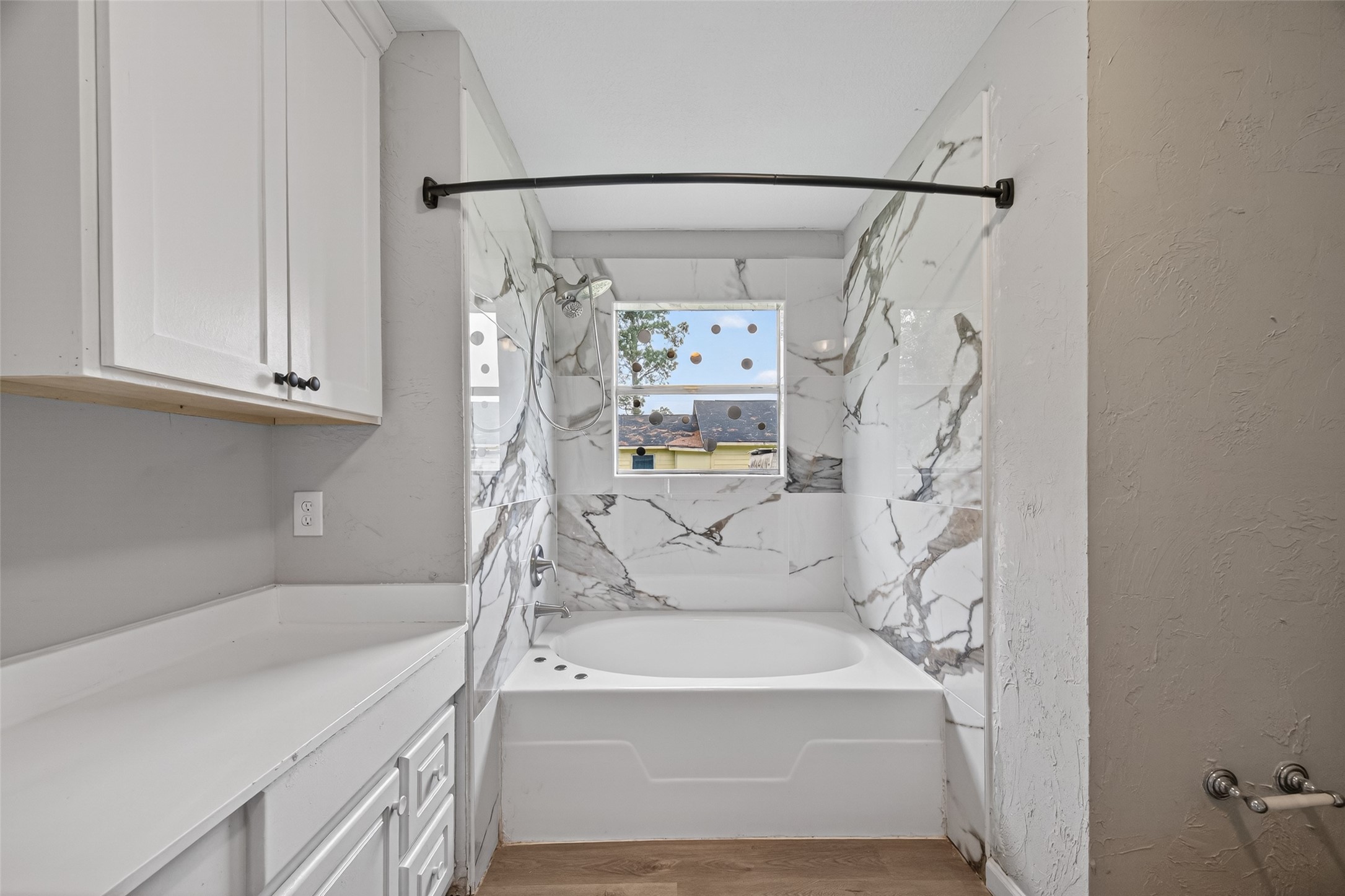 27812 Red Fox Road Tomball, TX 77377 - Photo 18 of 33 a bathroom with a bathtub and a shower