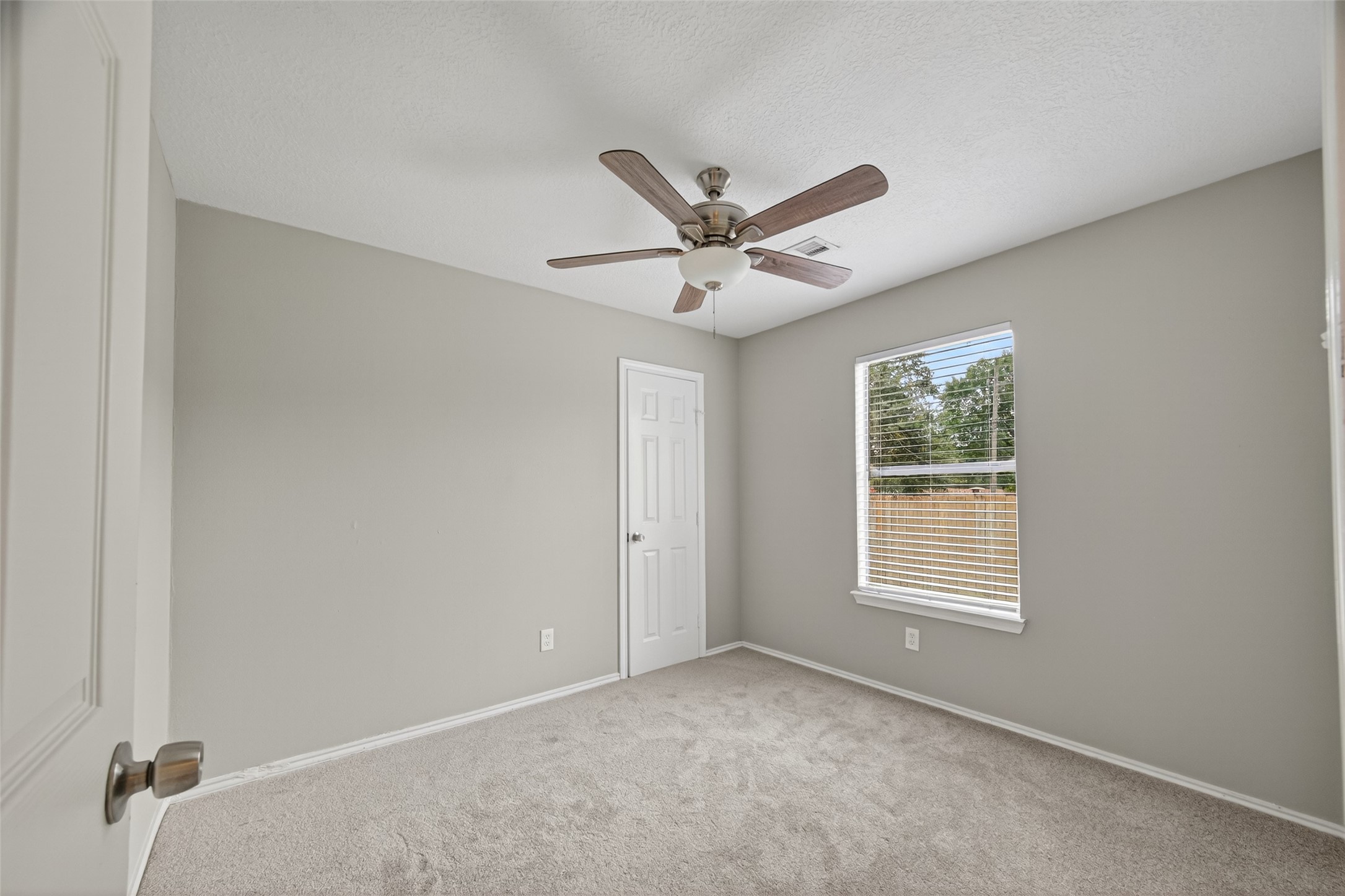27812 Red Fox Road Tomball, TX 77377 - Photo 20 of 33 a view of an empty room with a window