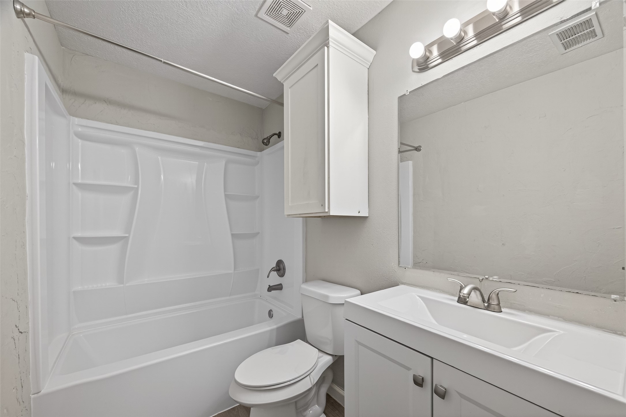 27812 Red Fox Road Tomball, TX 77377 - Photo 22 of 33 a bathroom with a sink a toilet and bathtub