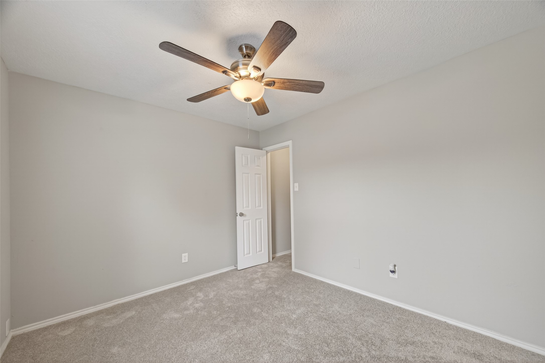 27812 Red Fox Road Tomball, TX 77377 - Photo 25 of 33 an empty room with windows and fan