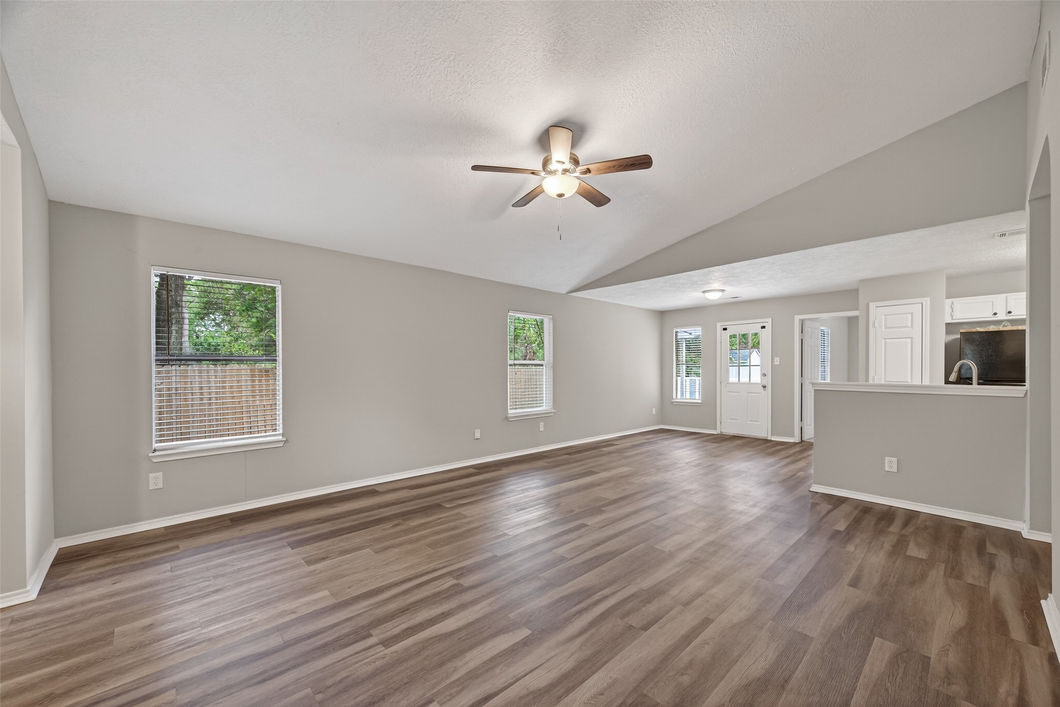 27812 Red Fox Road Tomball, TX 77377 - Photo 6 of 33 a view of empty room with wooden floor and fan