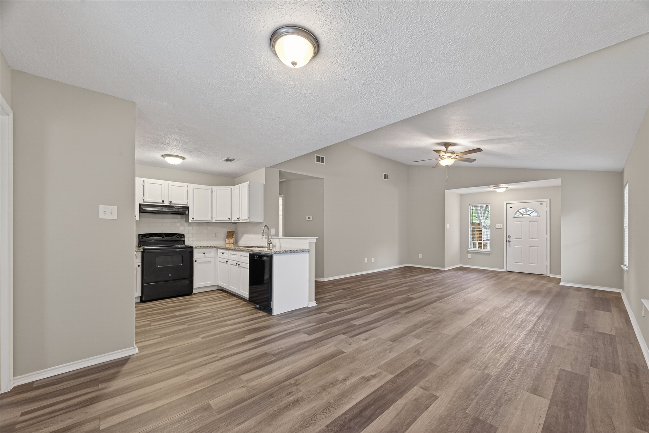 27812 Red Fox Road Tomball, TX 77377 - Photo 10 of 33 a view of kitchen with sink and wooden floor