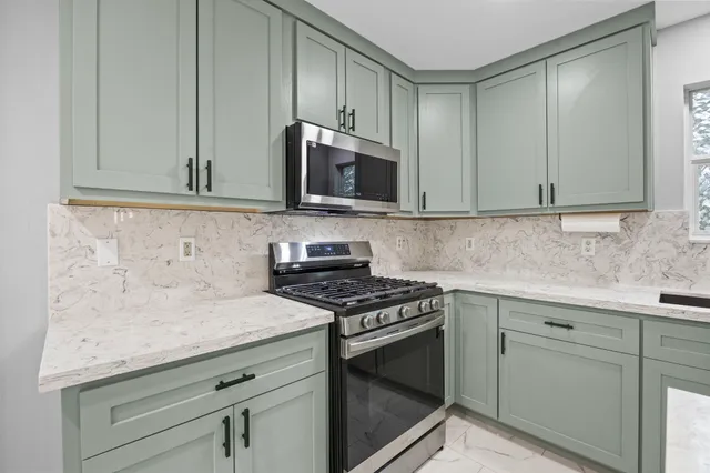 a view of an empty room with stairs