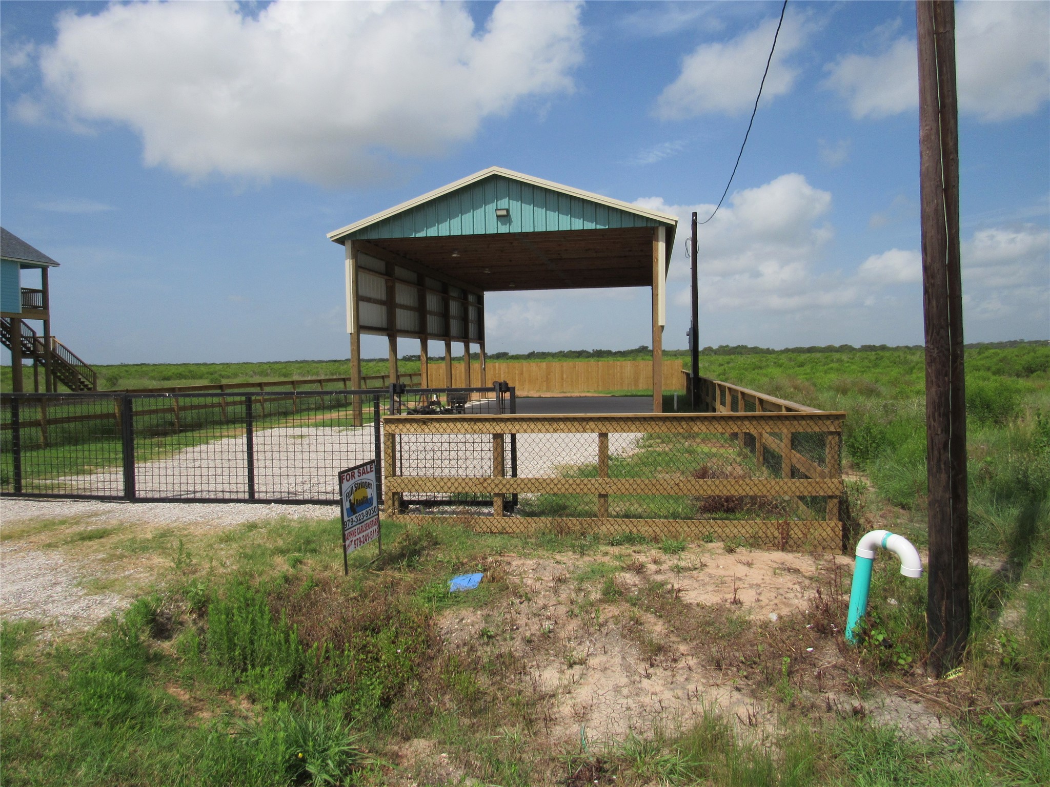 72 County Road 299 Sargent, TX 77414 - Photo 2 of 3 a view of a bench in the back yard