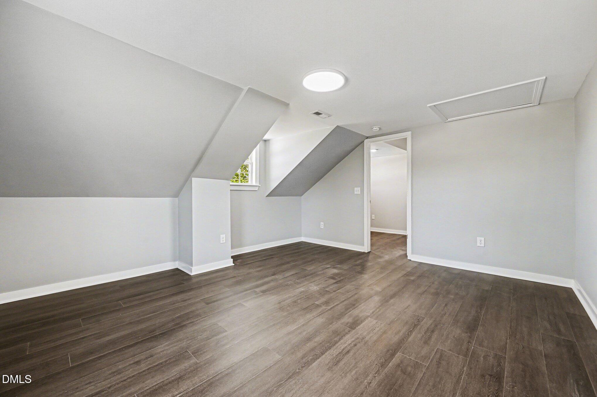 1325 Charlie Carr Road Roxboro, NC 27574 - Photo 21 of 31 a view of an empty room with wooden floor