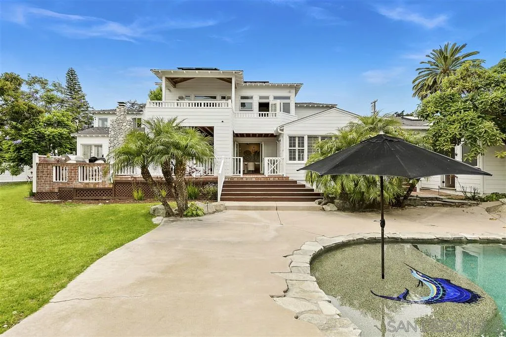 1441 Crest Drive Encinitas, CA 92024 - Photo 21 of 25 a front view of a house with a garden