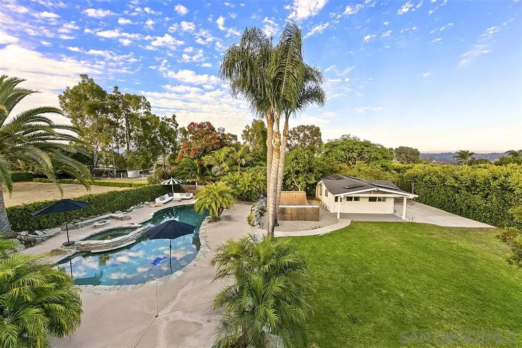 1441 Crest Drive Encinitas, CA 92024 - Photo 22 of 25 a view of a swimming pool with a patio and garden