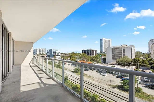 a view of a balcony with city