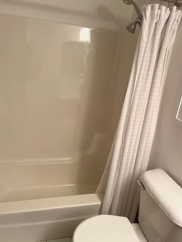 a kitchen with a sink stove top oven and cabinets