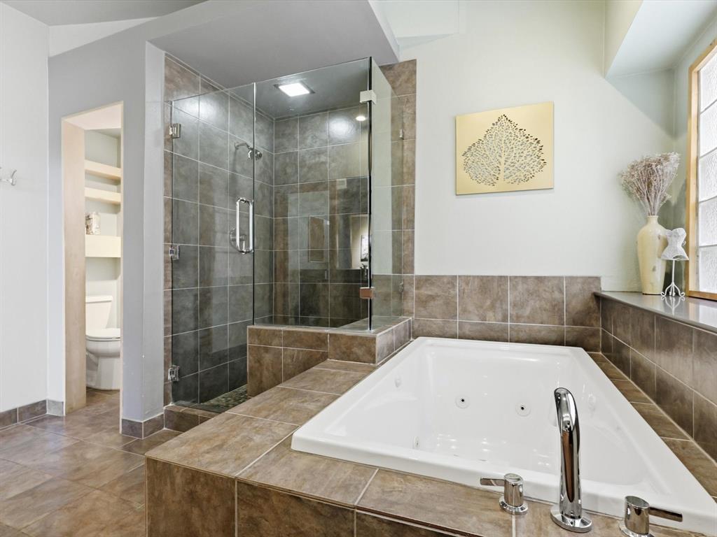 851 Chalfont Place Coppell, TX 75019 - Photo 16 of 36 a bathroom with a bathtub and shower