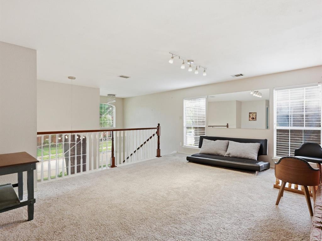 851 Chalfont Place Coppell, TX 75019 - Photo 21 of 36 a living room with furniture and a flat screen tv