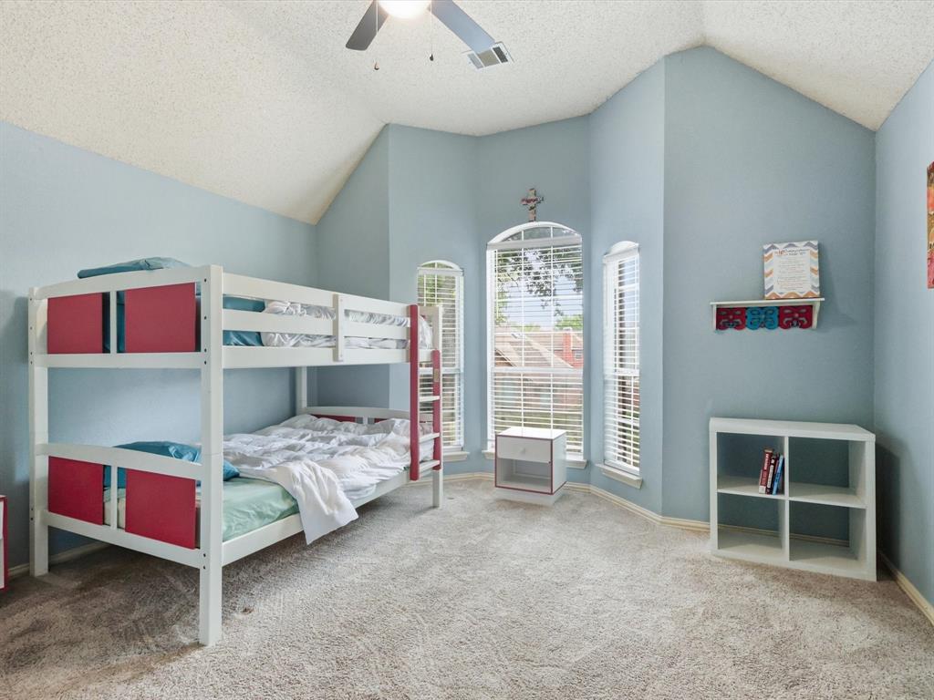 851 Chalfont Place Coppell, TX 75019 - Photo 23 of 36 a bedroom with furniture and a large window