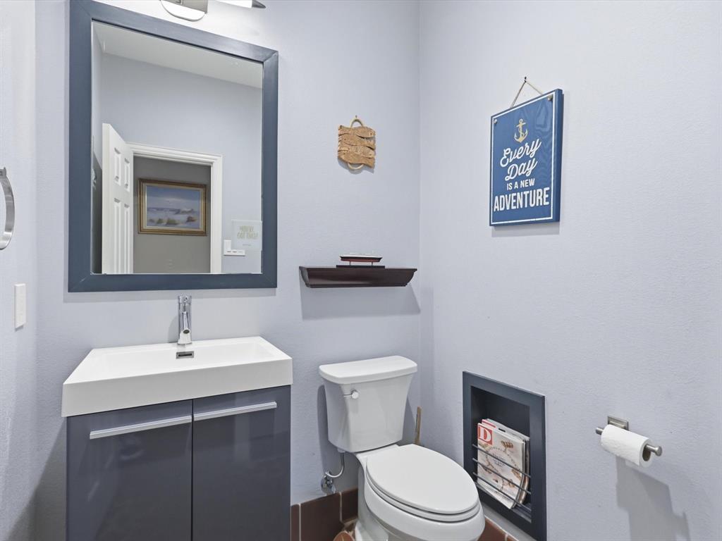851 Chalfont Place Coppell, TX 75019 - Photo 25 of 36 a bathroom with a toilet a sink and mirror