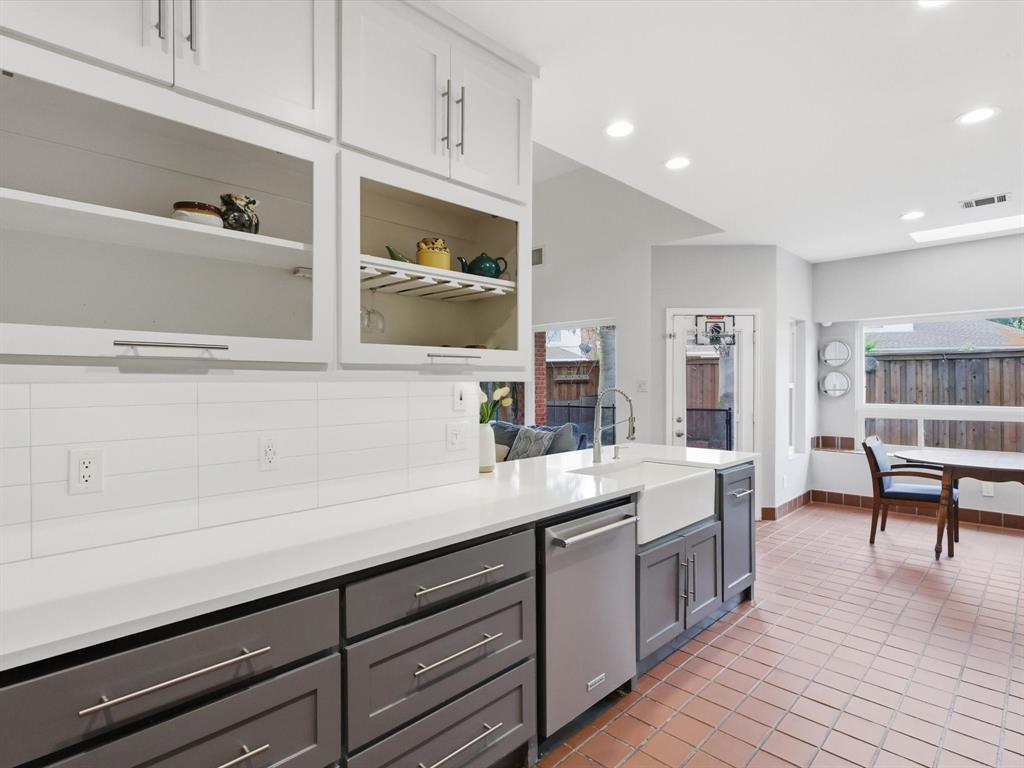 851 Chalfont Place Coppell, TX 75019 - Photo 6 of 36 a kitchen with a sink cabinets and wooden floor