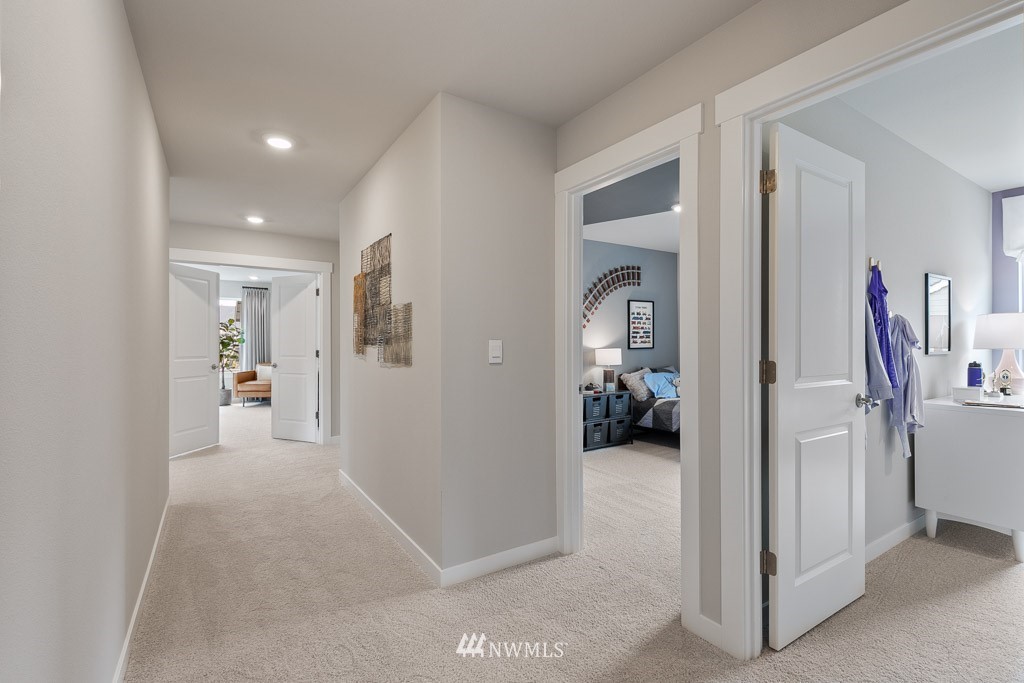 30 180th Place Southeast, Unit 23 Bothell, WA 98012 - Photo 11 of 21 a view of a hallway view with three rooms
