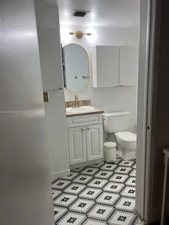 a bathroom with a toilet and a sink