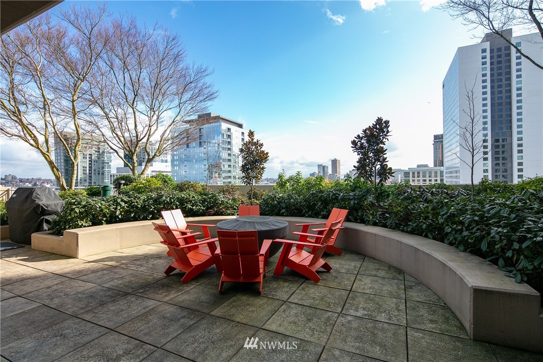 819 Virginia Street, Unit 2804 Seattle, WA 98101 - Photo 13 of 22 a wooden bench sitting in backside of a building