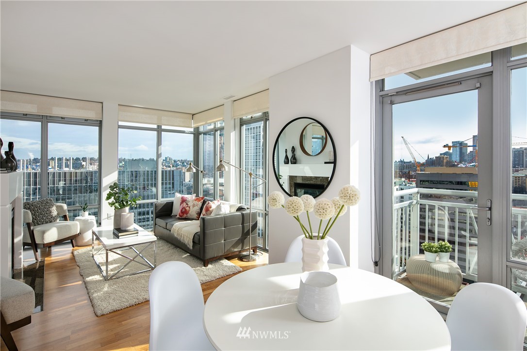 819 Virginia Street, Unit 2804 Seattle, WA 98101 - Photo 3 of 22 a living room with furniture a table and a large window