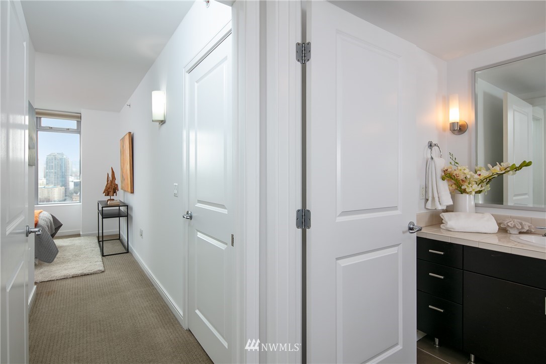 819 Virginia Street, Unit 2804 Seattle, WA 98101 - Photo 10 of 22 a en suite bathroom with a sink mirror and